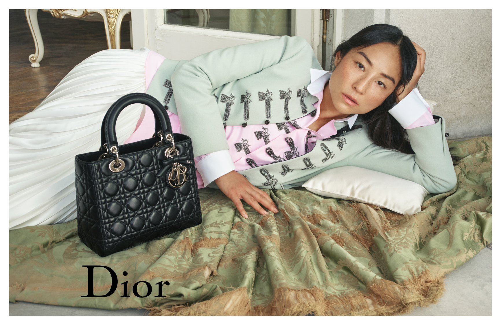 A Christian Dior advertisement of their latest collection for THE GOODS. A male model walks amongst sand mounds.