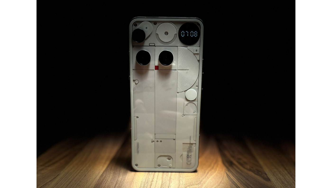 Nothing Phone (3) Glyph Matrix LEDs glowing in circular pattern on back panel in low light.