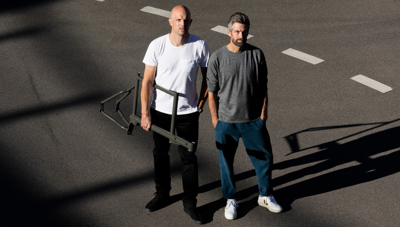 Standing together with the MONoPOLE frame, Nicola Stäubli and Daniel Freitag, co-founders of MONoPOLE