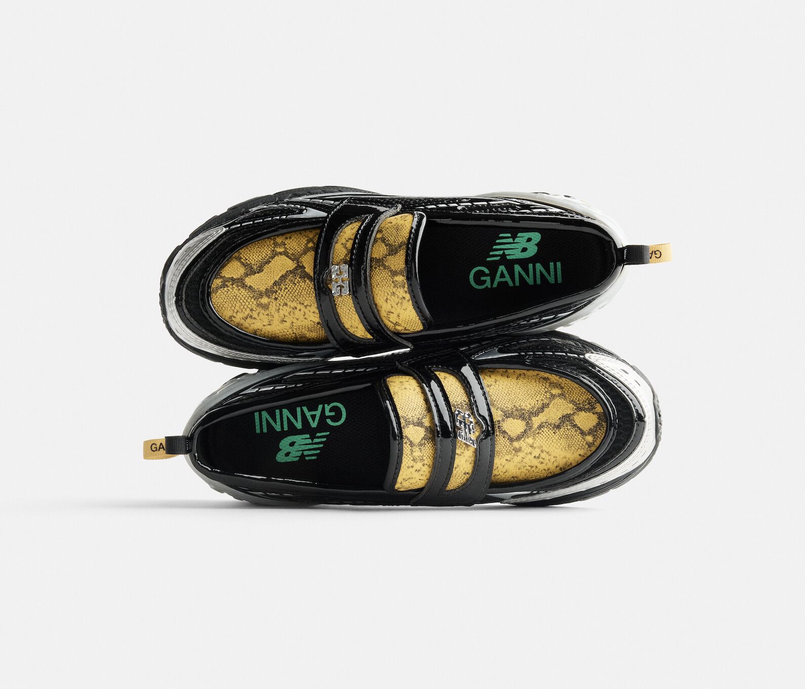 Top view of Ganni x New Balance 1906L snoafer, penny loafer design with running sole and snakeskin texture, 2025 collaboration sneaker.