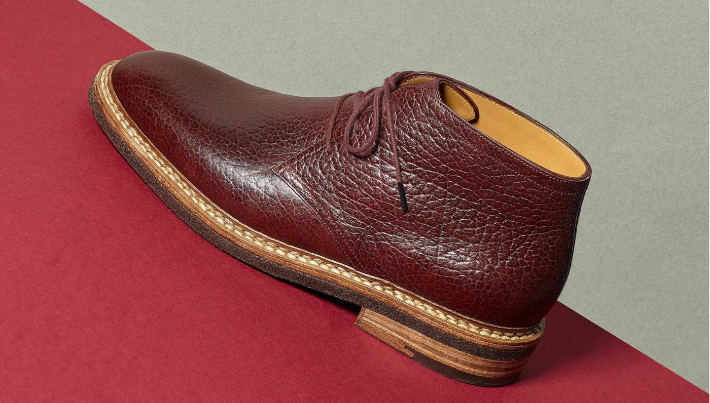 A close up of a maroon custom shoe by Massaro, Paris.