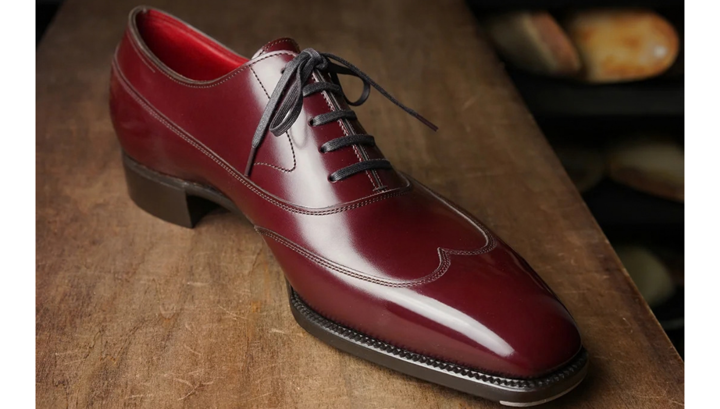 Yohei Fukada maroon brogues, shoes, close up.
