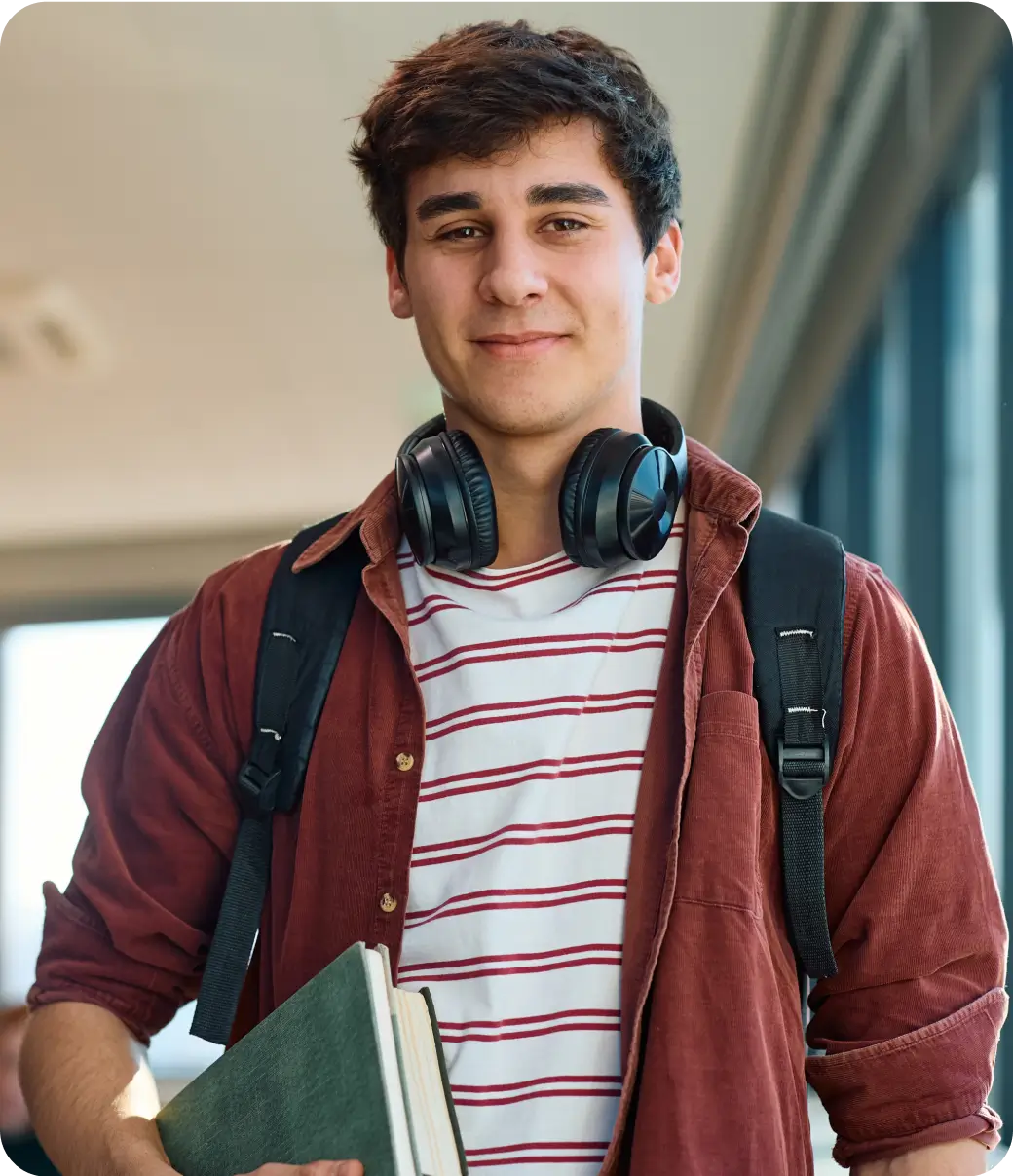 A student holding a book