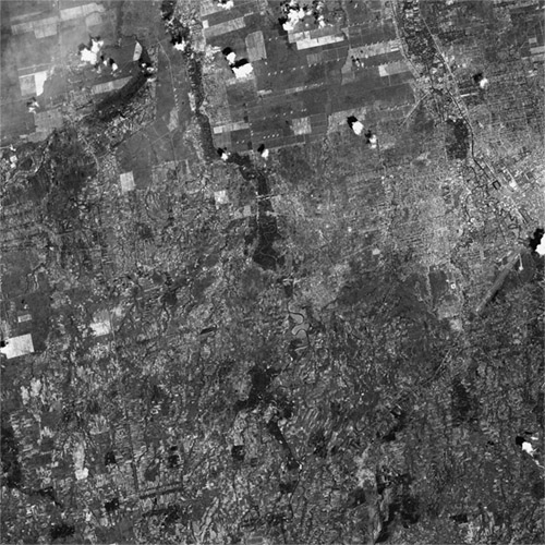 A high resolution declassified KH-7 GAMBIT spy satellite image of Medan, Indonesia from December 5, 1964.