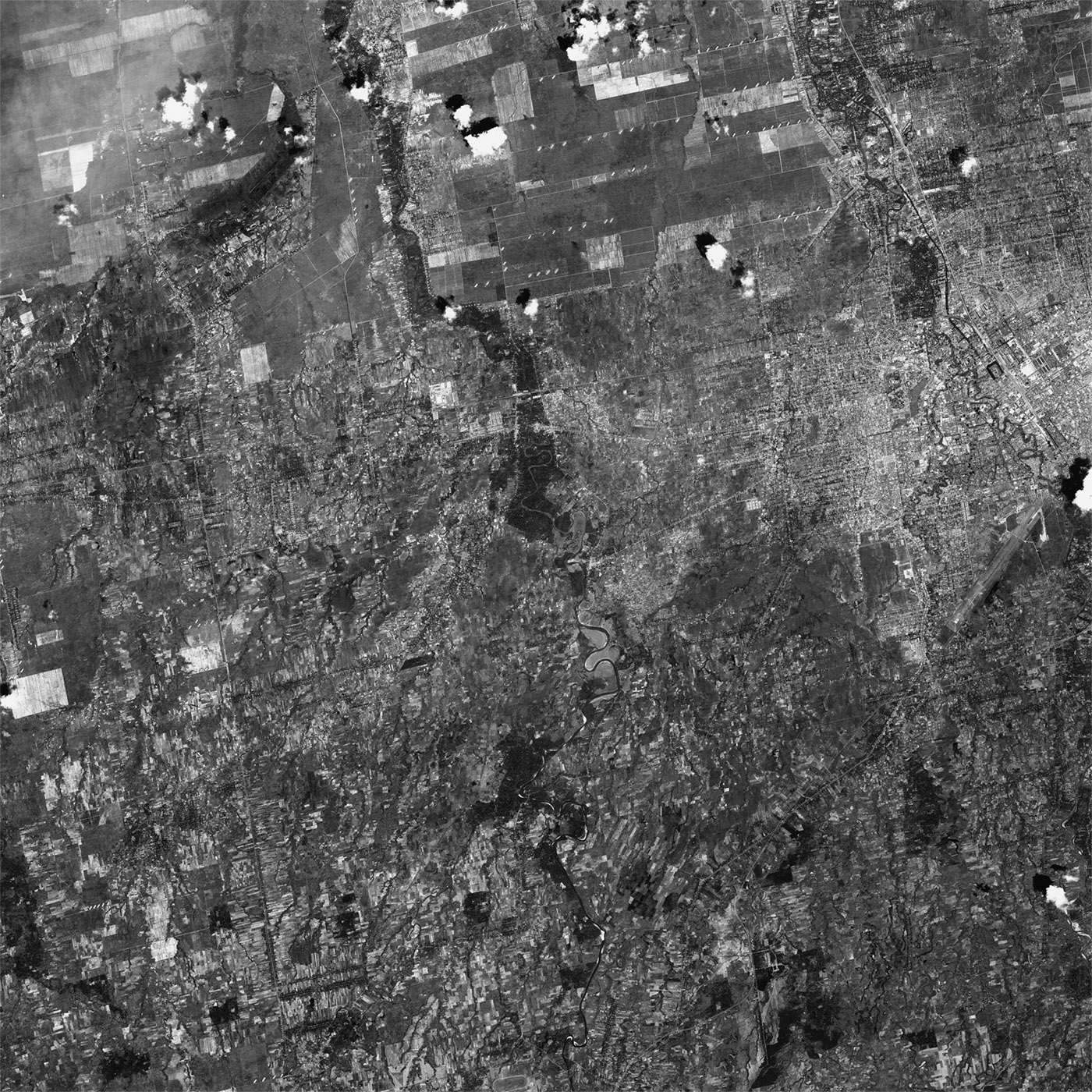 A high resolution declassified KH-7 GAMBIT spy satellite image of Medan, Indonesia from December 5, 1964.