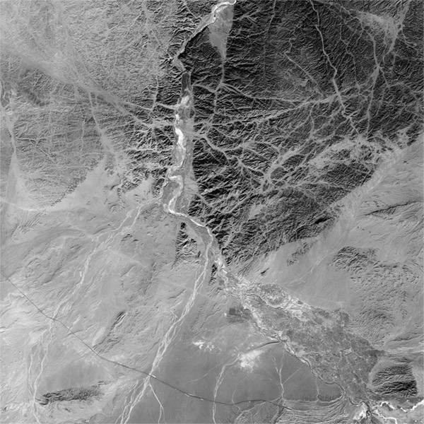 A high resolution declassified KH-7 GAMBIT spy satellite image of Yumen City, China from January 26, 1965.