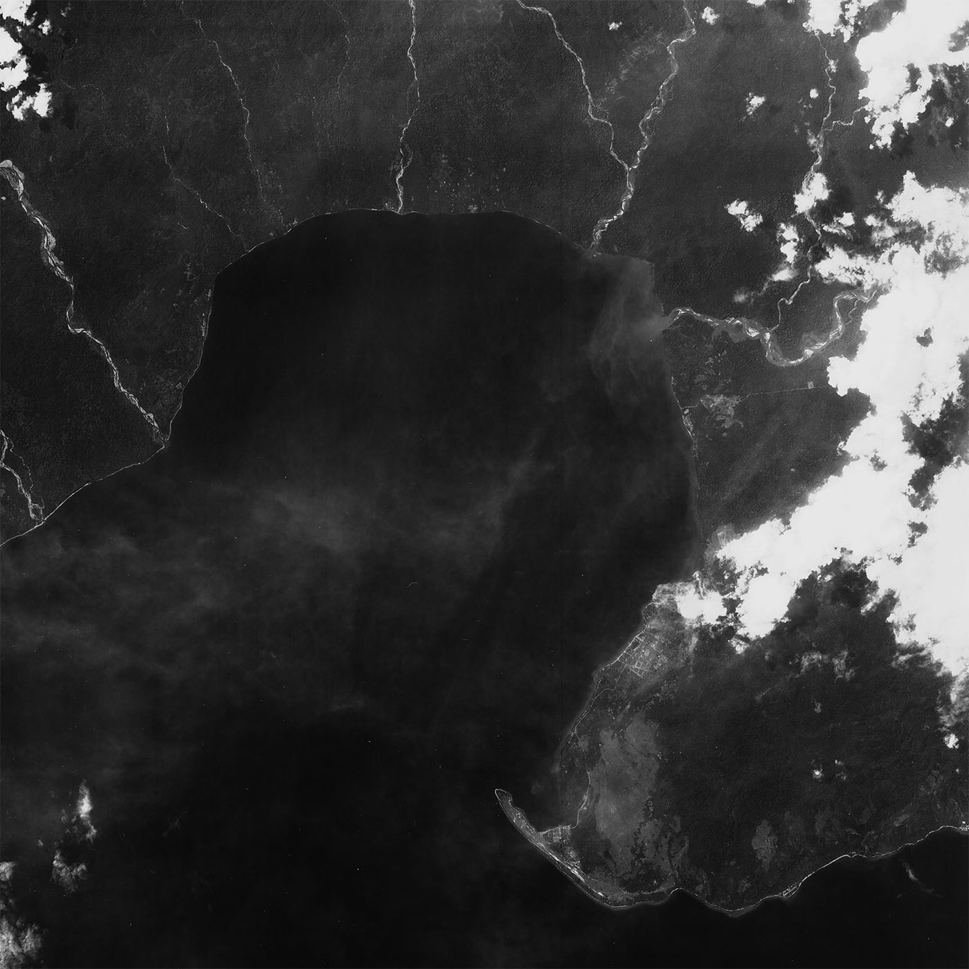 A high resolution declassified KH-7 GAMBIT spy satellite image of Amahai, Indonesia from May 1, 1965.