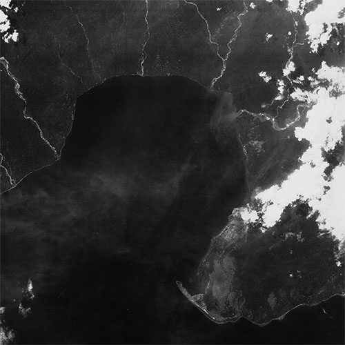 A high resolution declassified KH-7 GAMBIT spy satellite image of Amahai, Indonesia from May 1, 1965.