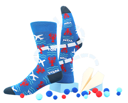 Photo of 3 different custom socks with labels resting on the table beside Pantone threads.