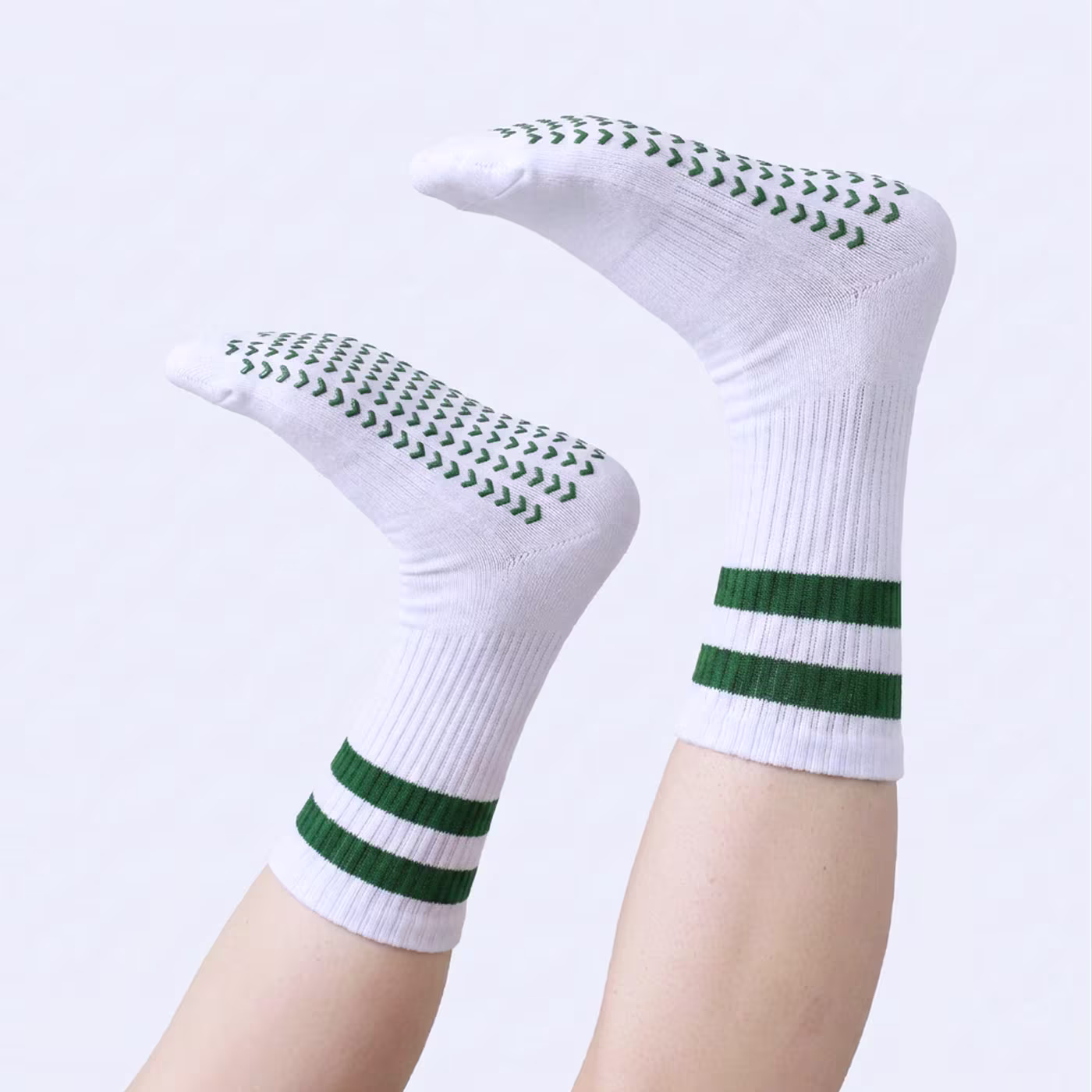 The foot of a man with premium quality green custom dress socks