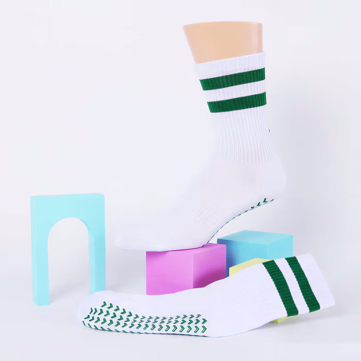The foot of a man with premium quality green custom dress socks