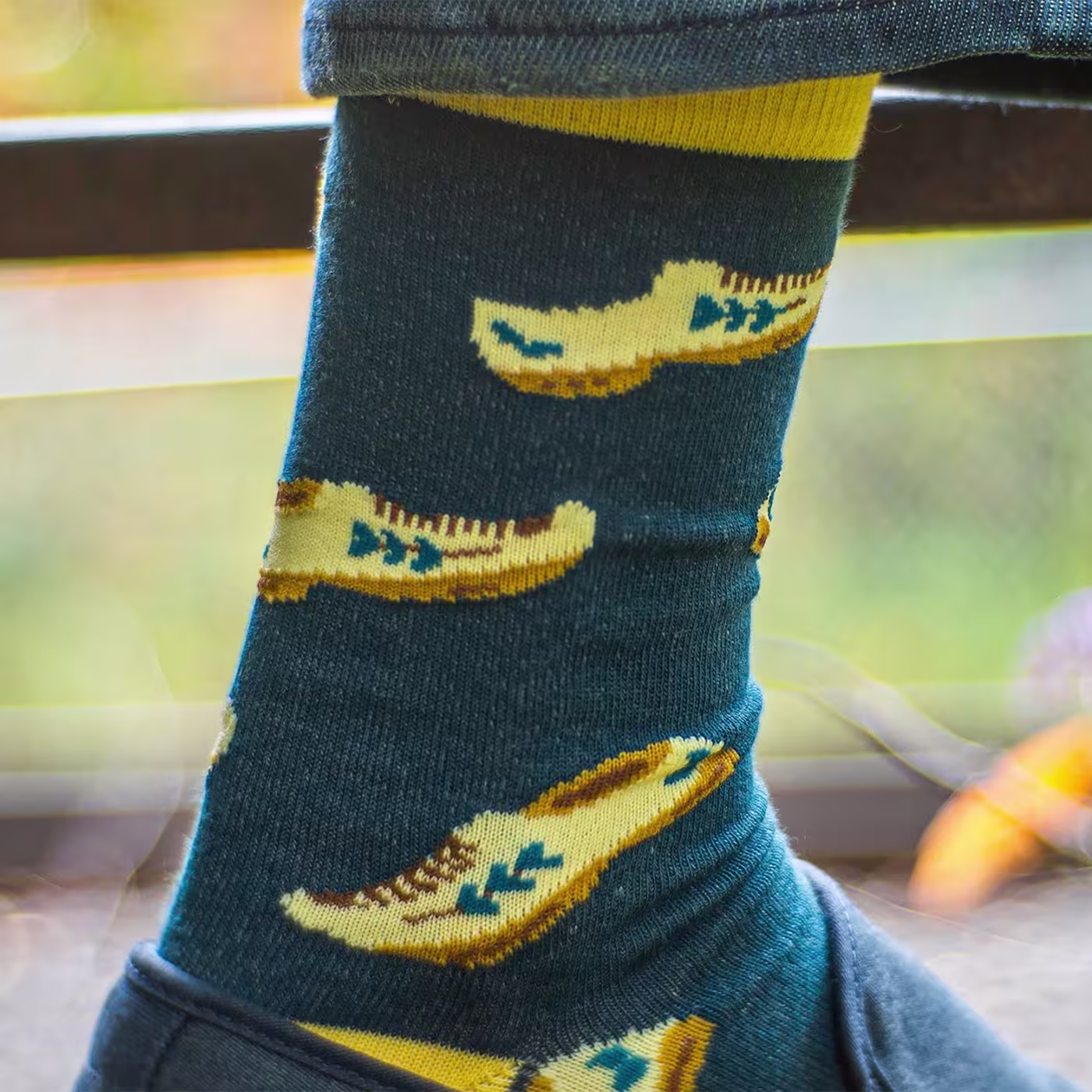 The foot of a man with premium quality green custom dress socks