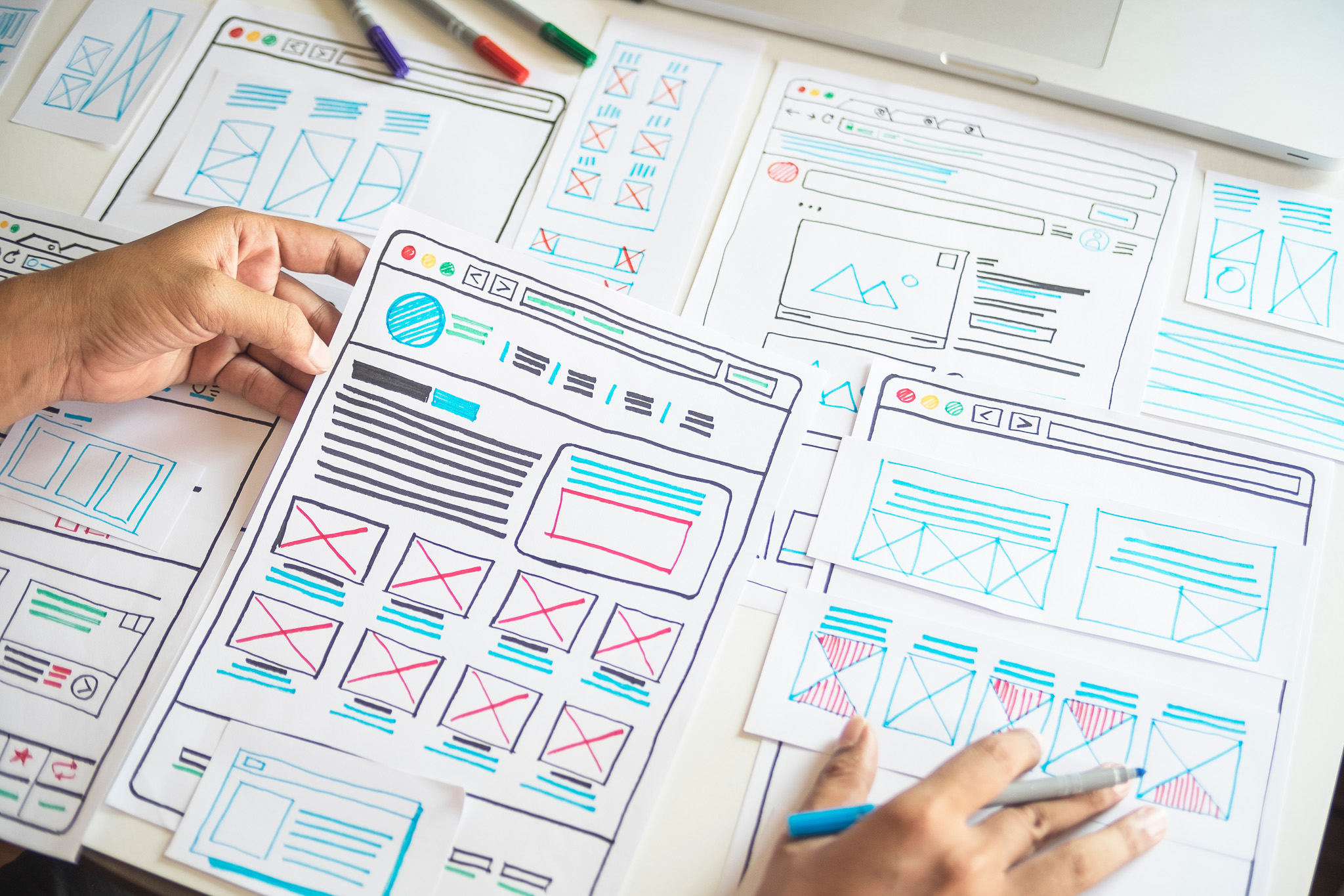 Hands spread out the UI | UX of an app design