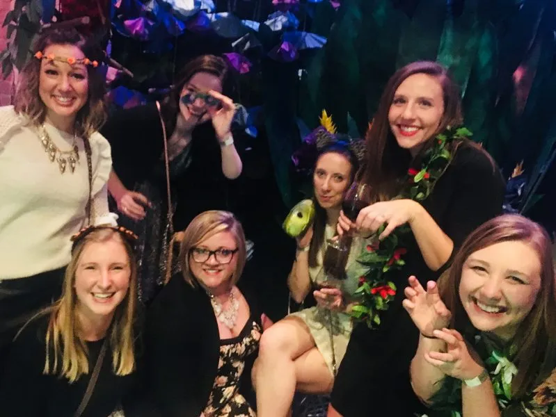 ISG employee-owners pose in front of photobooth