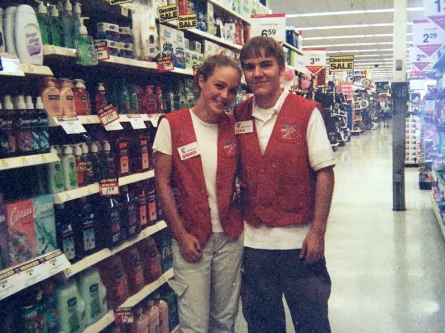 young K-Mart employees in store aisle