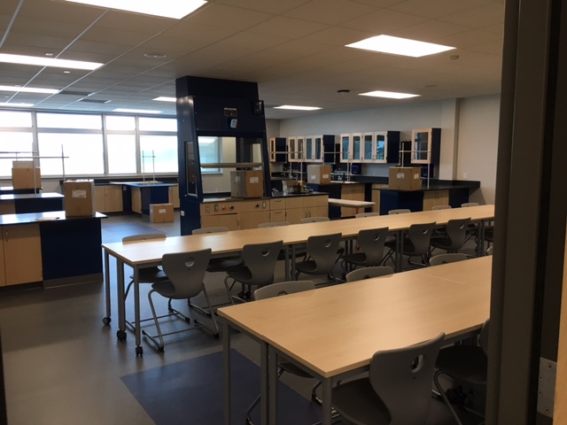 high school classroom with large tables on wheels for desk space