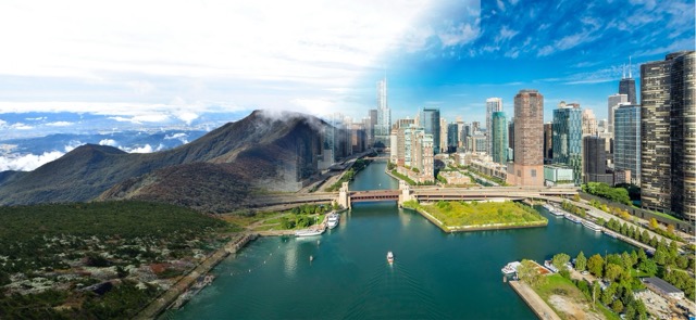 Aerial view of Chicago skyline with river and mountain landscape in background