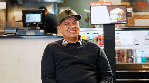 Happy restaurant owner with his Thisway kiosk.