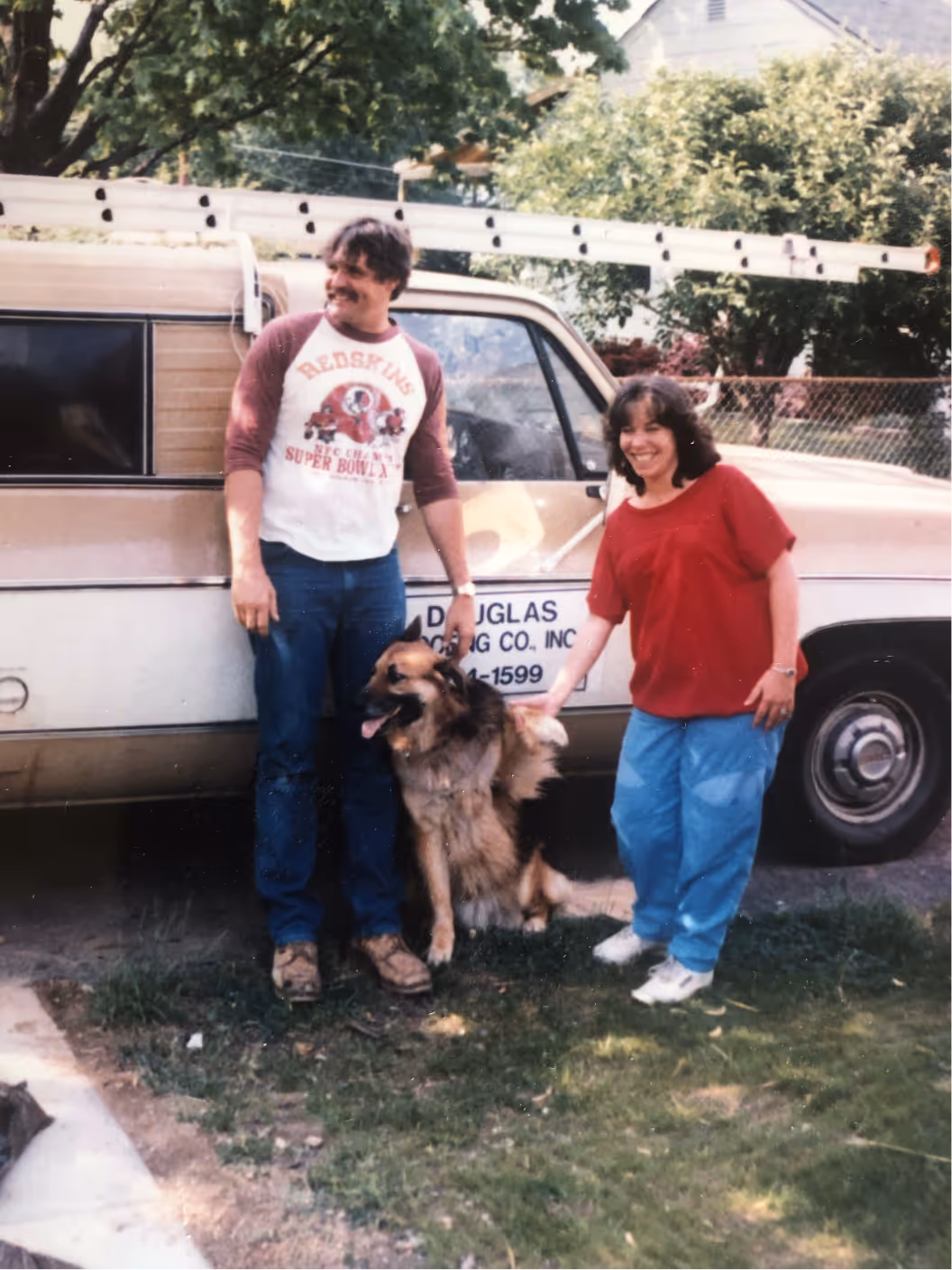 The Douglas Who Started Douglas Roofing In Northern Virginia Standing With His Wife And Dog.