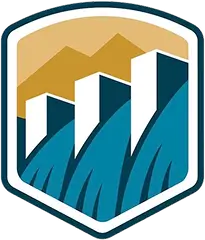 Shield-shaped logo featuring stylized mountains above white dam structures with blue water flow.