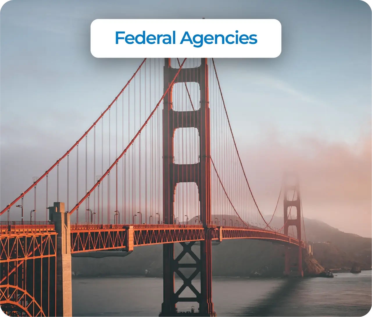 Cable-stayed bridge with white towers and orange accents spanning across a wide river on a clear day.