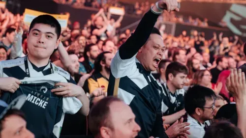 Team Liquid fans celebrating in an esports event.