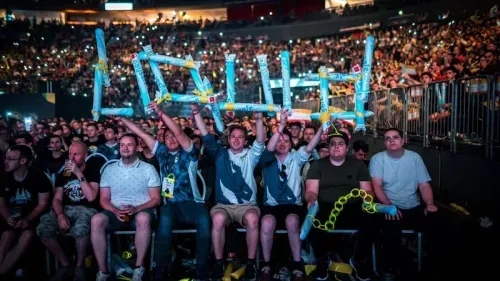 Team Liquid fans cheering at an esports event.