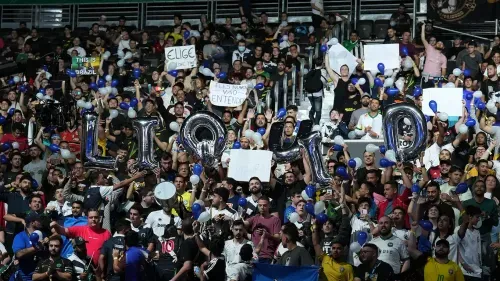 Fans cheering at an esports event.