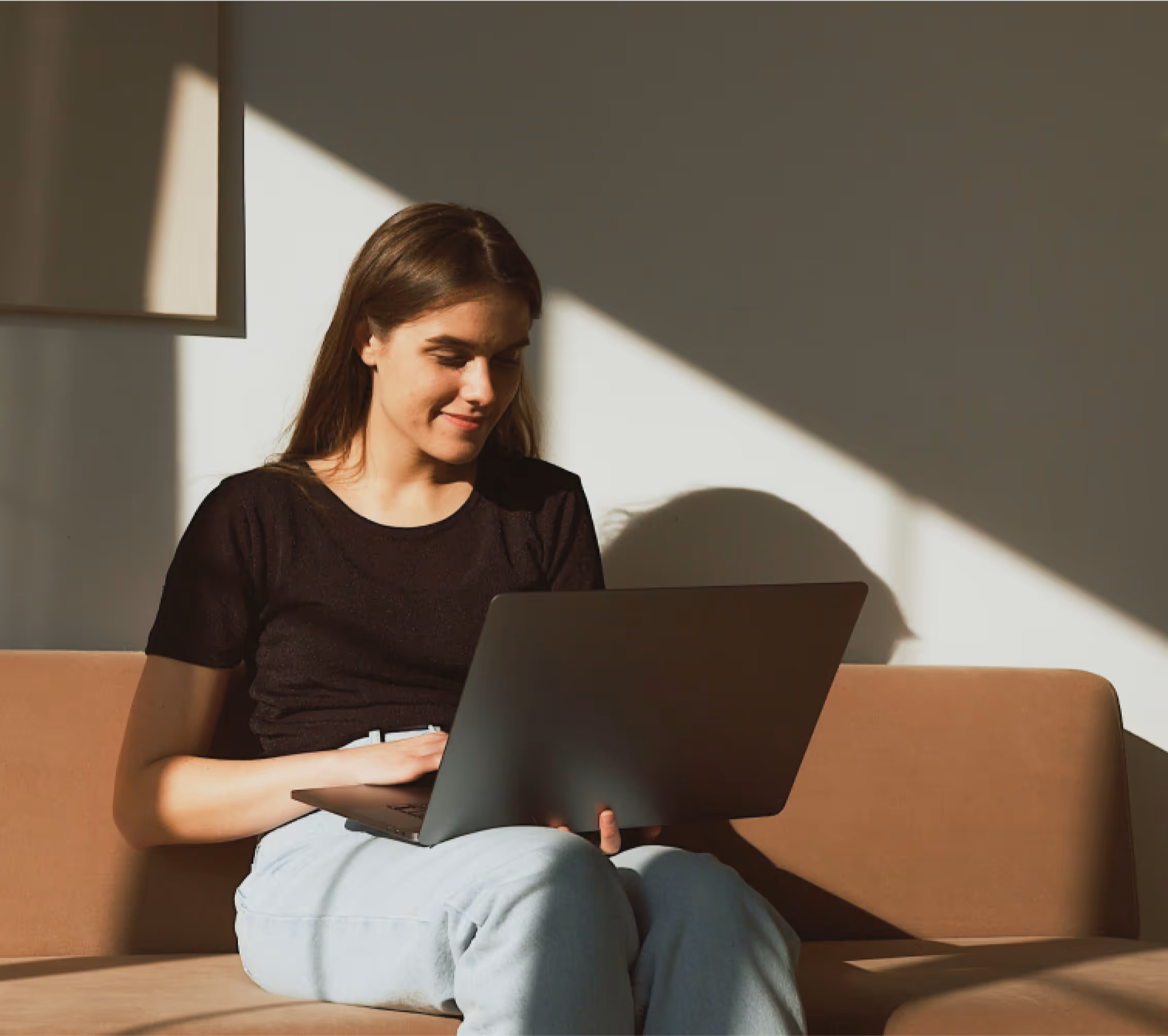 White woman completing loan application on laptop