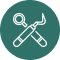 Crossed wrench and screwdriver icon inside a blue circle.