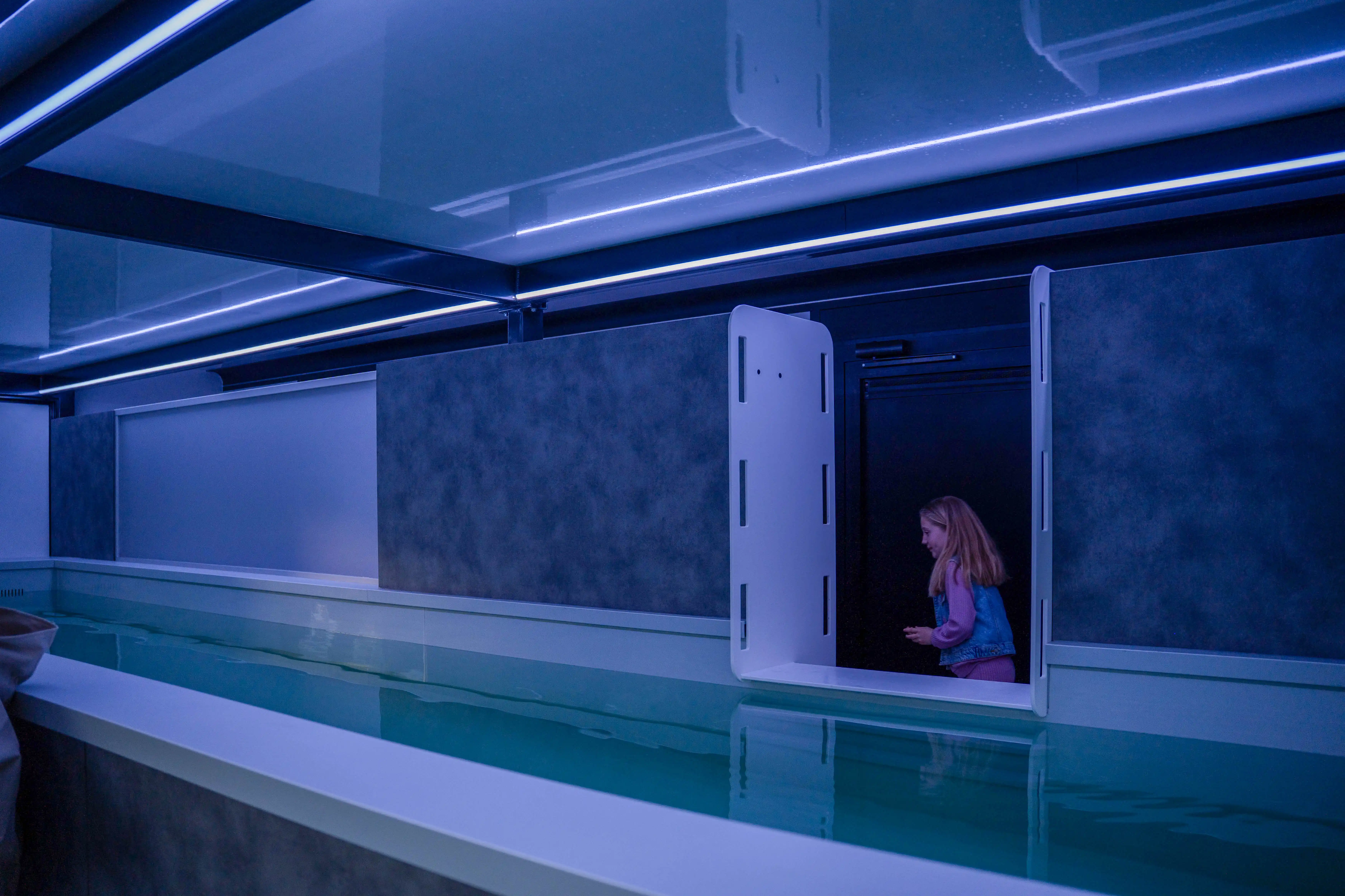 Mobile pool trailer setup with modular design, showcasing a luxurious pool installation in a scenic outdoor location.