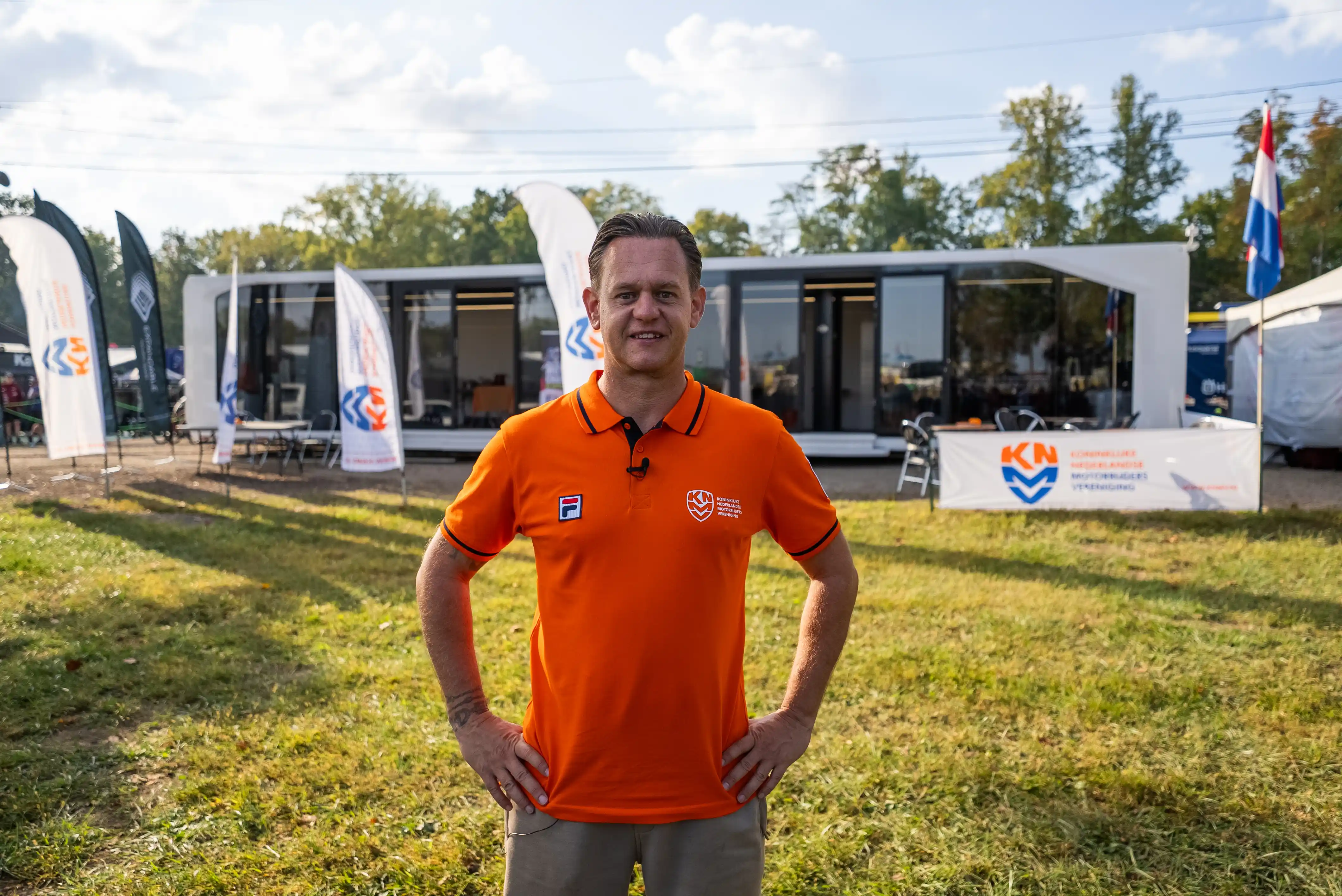 TeamNL manager Barry Forschelen stands in front of the Expandable Touchdown trailer at the Motocross of Nations in the United States — the team’s base for preparation, meetings, and recovery during the event.