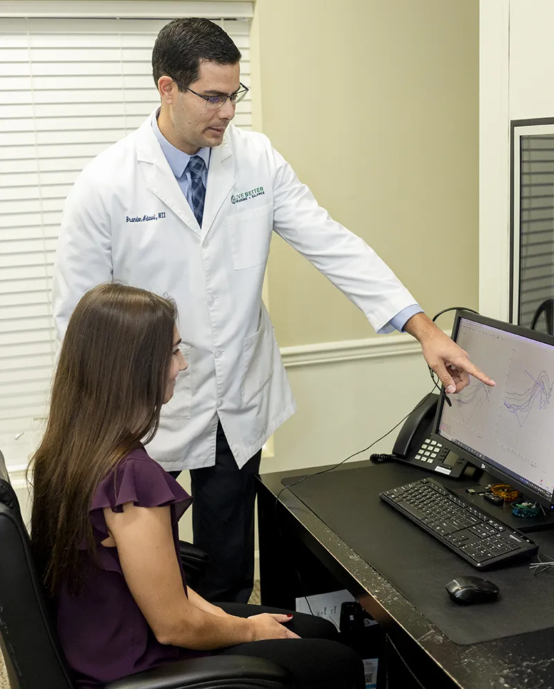 Audiologist reviewing audiogram with patient