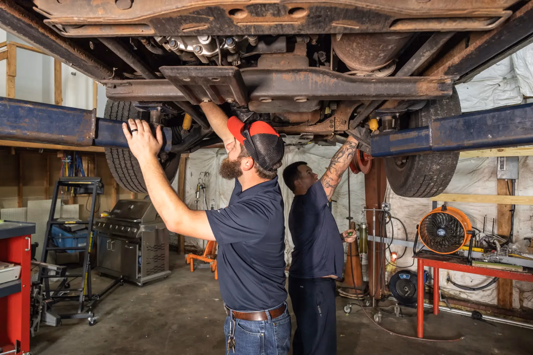 Diesel mechanic performing driveline repairs on semi truck in Fredericksburg, Virginia
