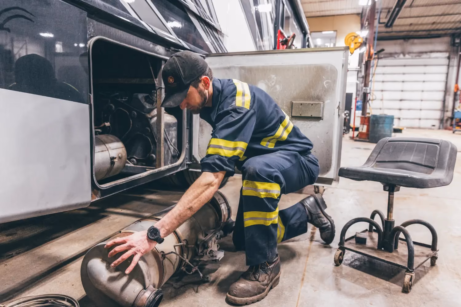 Diesel mechanic performing EGR & DPF services on semi truck in Fredericksburg, Virginia