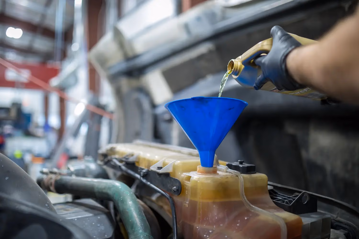 Diesel mechanic performing express lube service on semi truck in Fredericksburg, Virginia