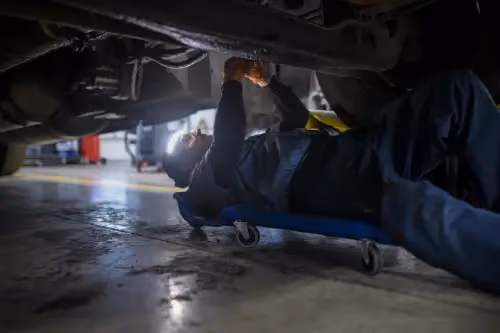 Diesel mechanic performing transmission repair on semi truck in Fredericksburg, Virginia