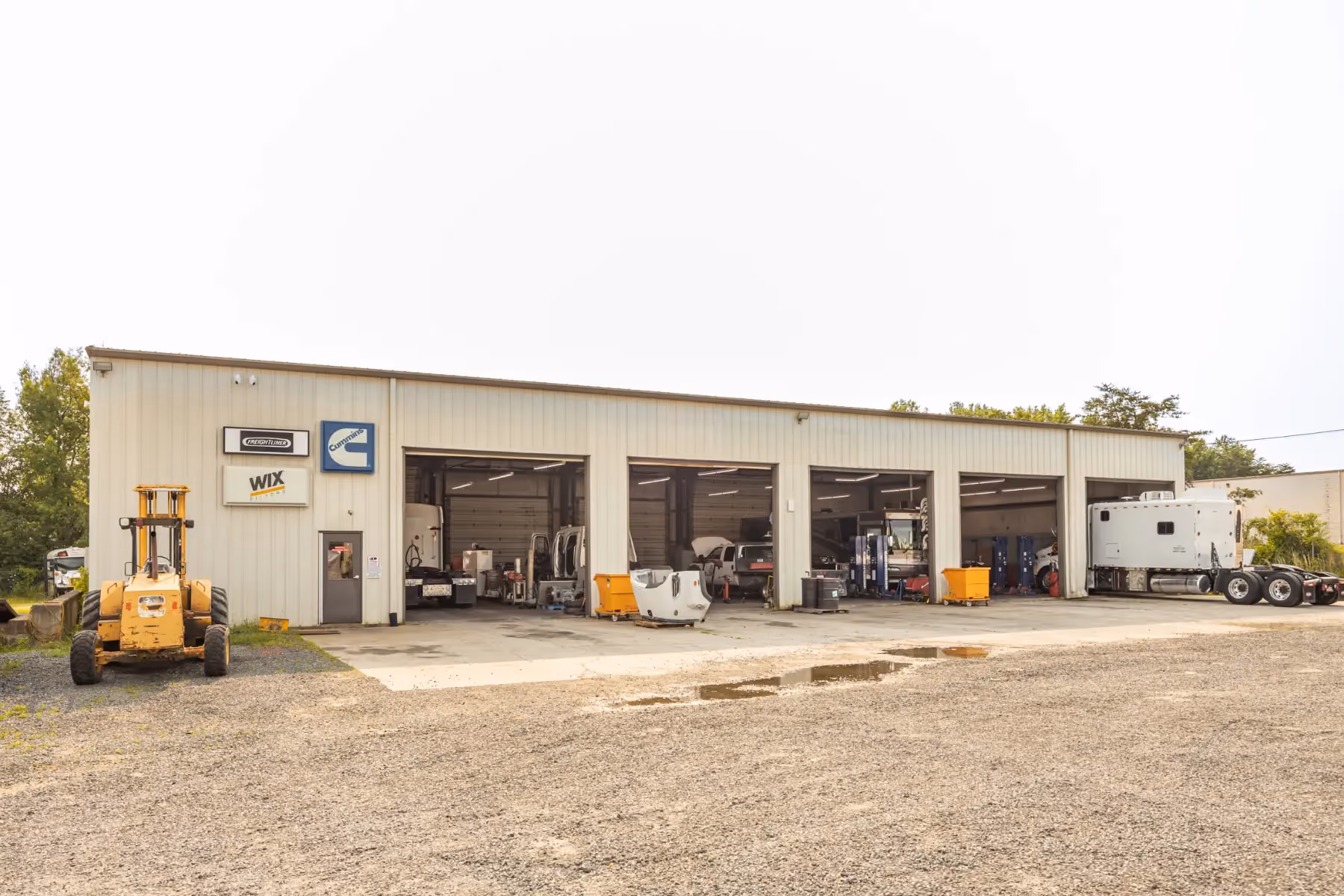 Diesel mechanic performing truck alignment in Fredericksburg, Virginia