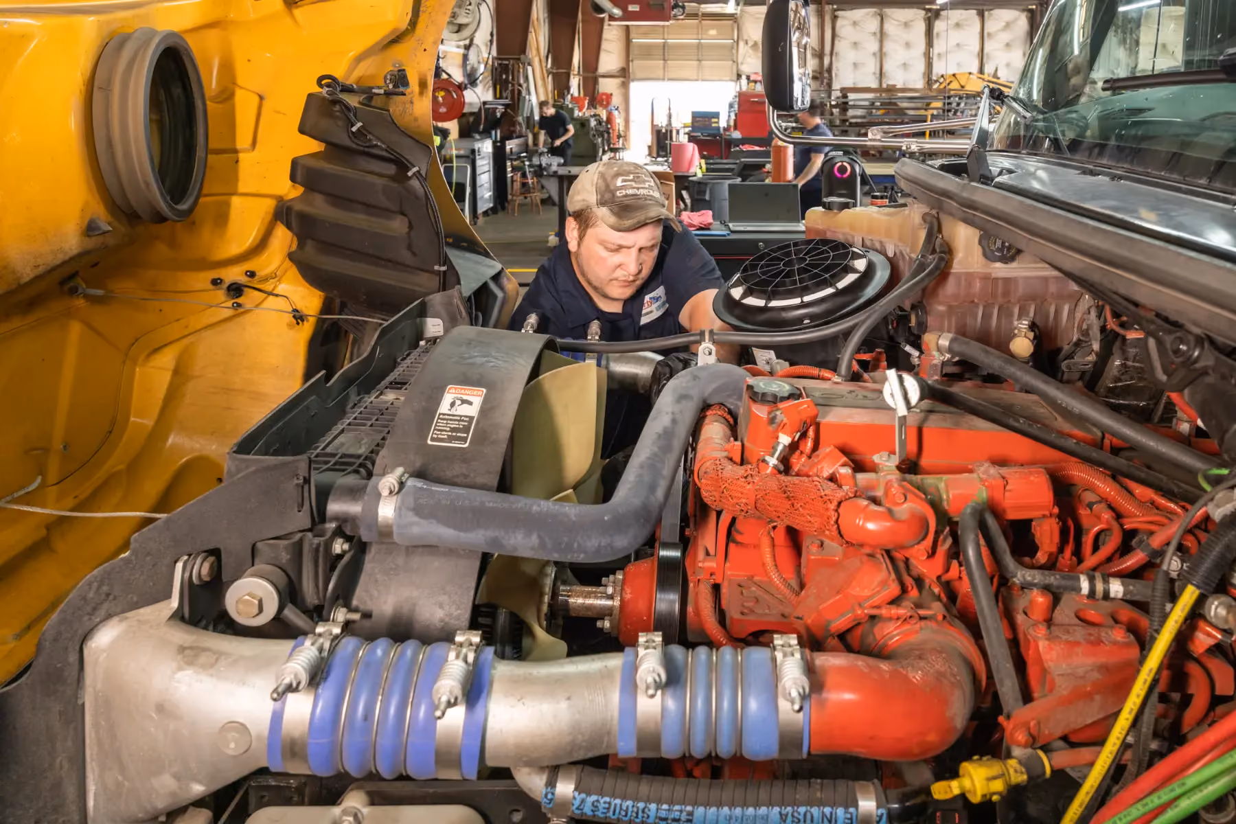 Diesel mechanic performing diesel engine repair services in Fredericksburg, Virginia