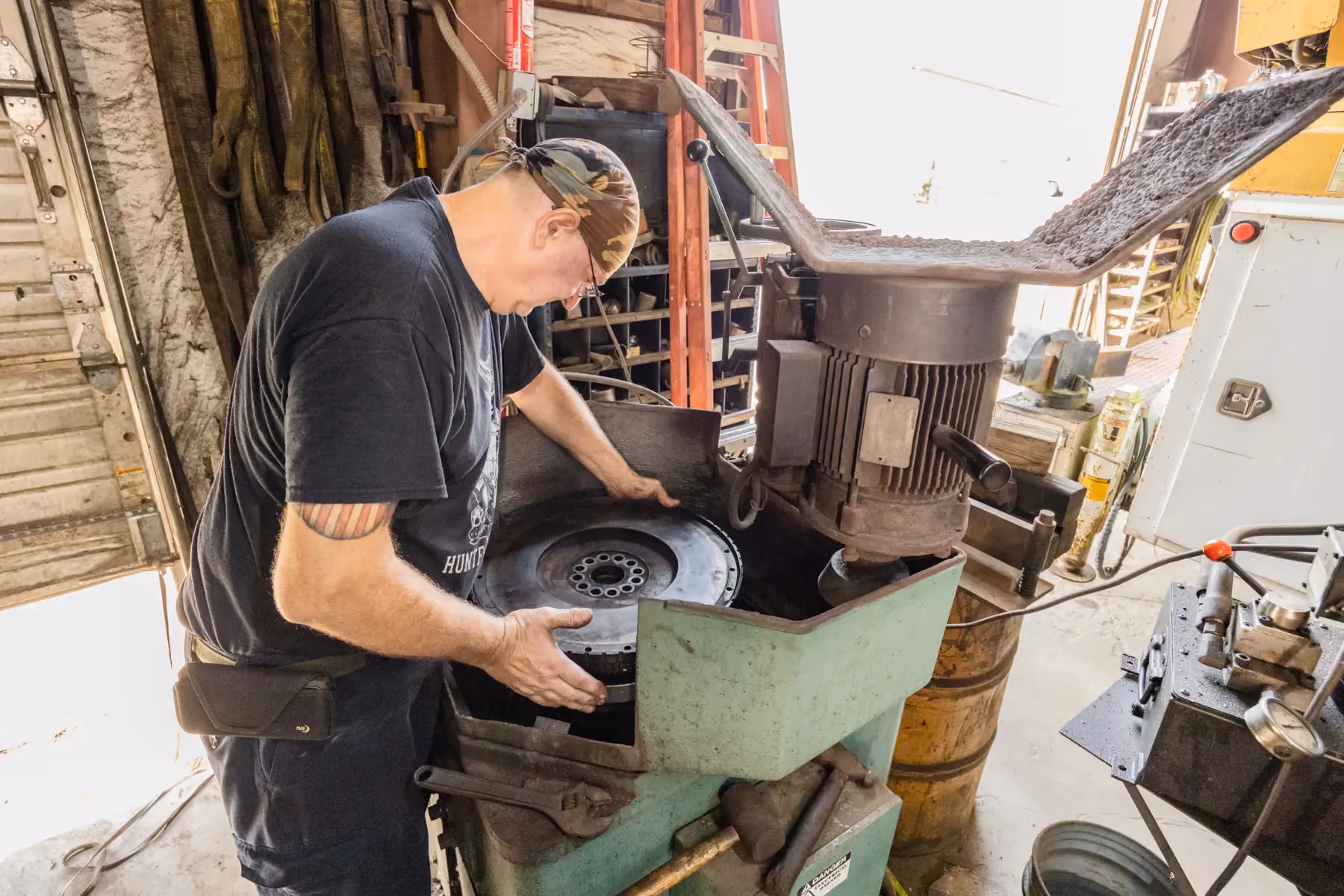 Diesel mechanic performing flywheel resurfacing services in Fredericksburg, Virginia