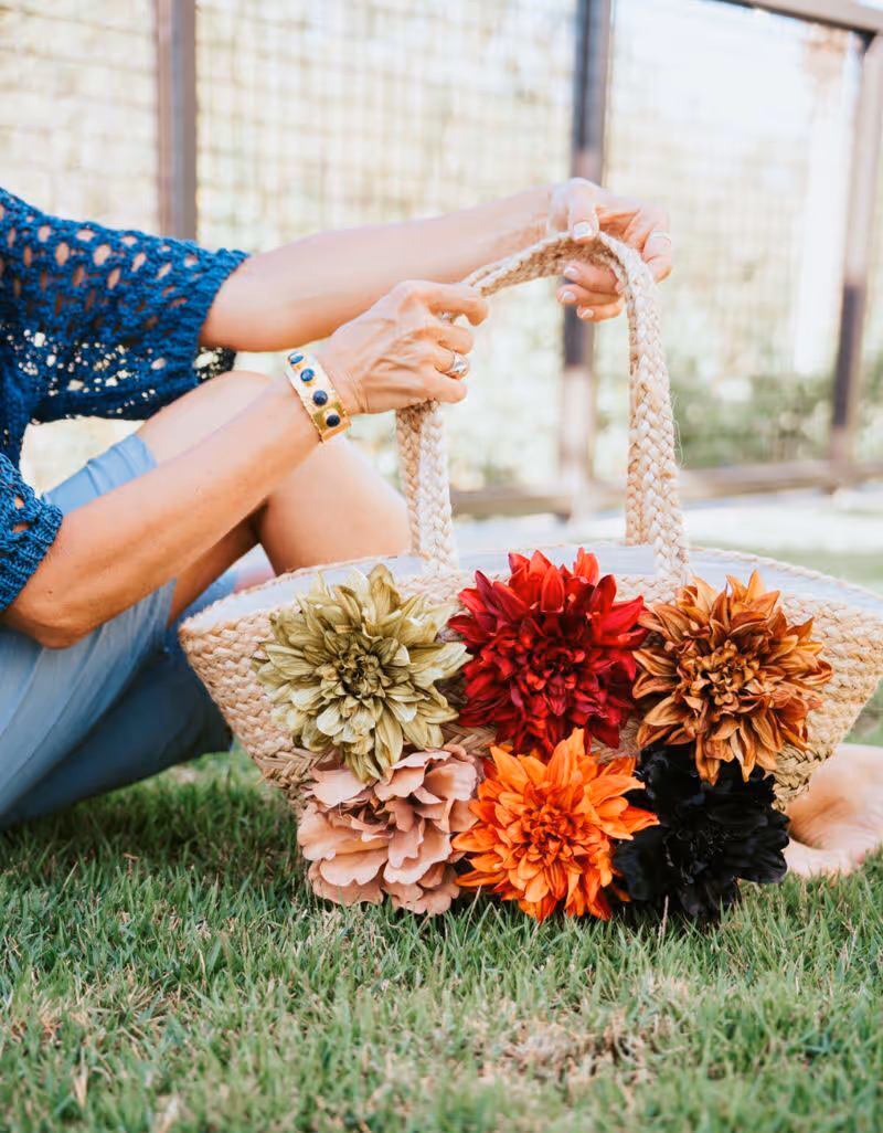 A hand crafted bag with handmade flowers