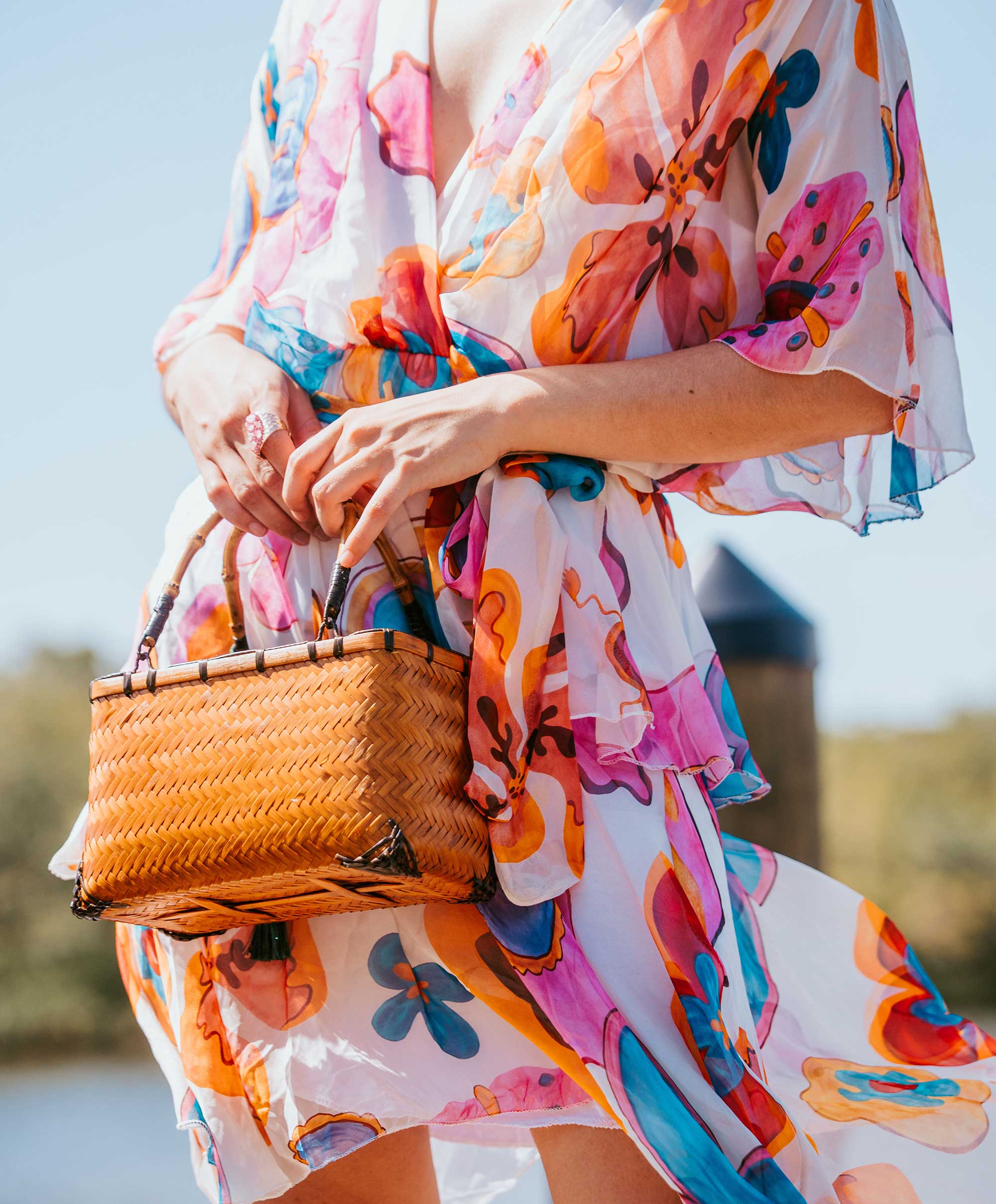 Couple embracing on balcony overlooking lush river landscape