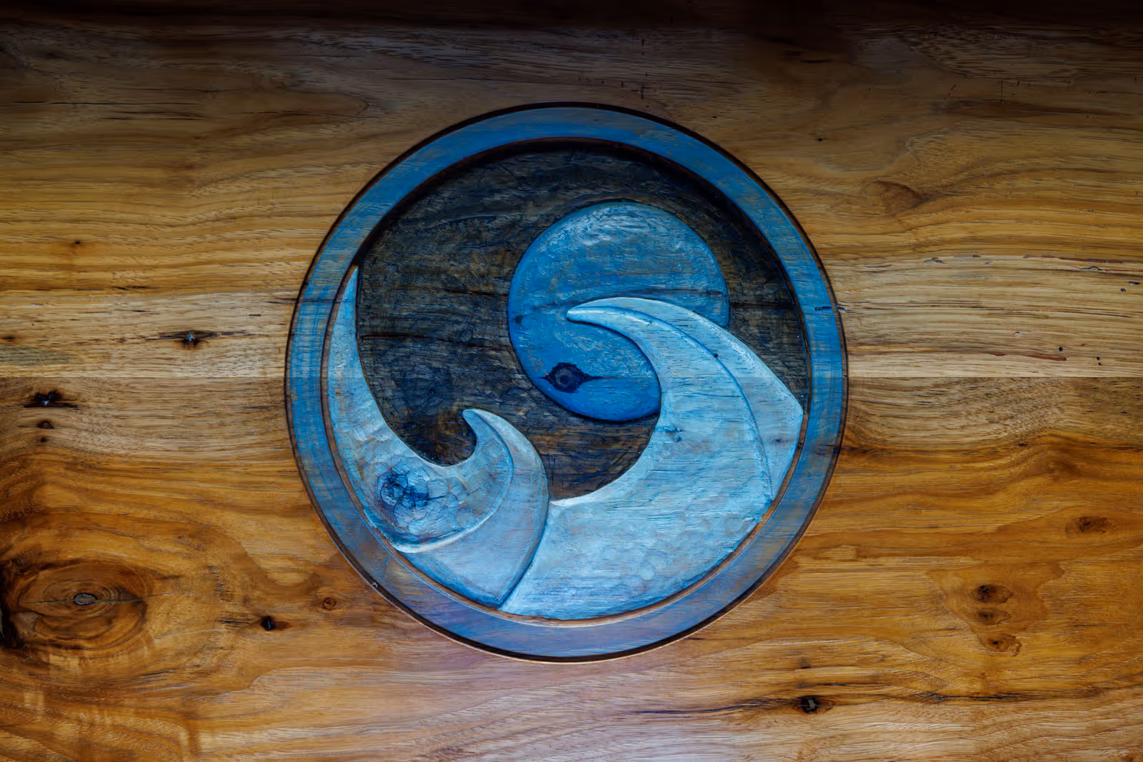 Blue moon beach grill logo carved into wood