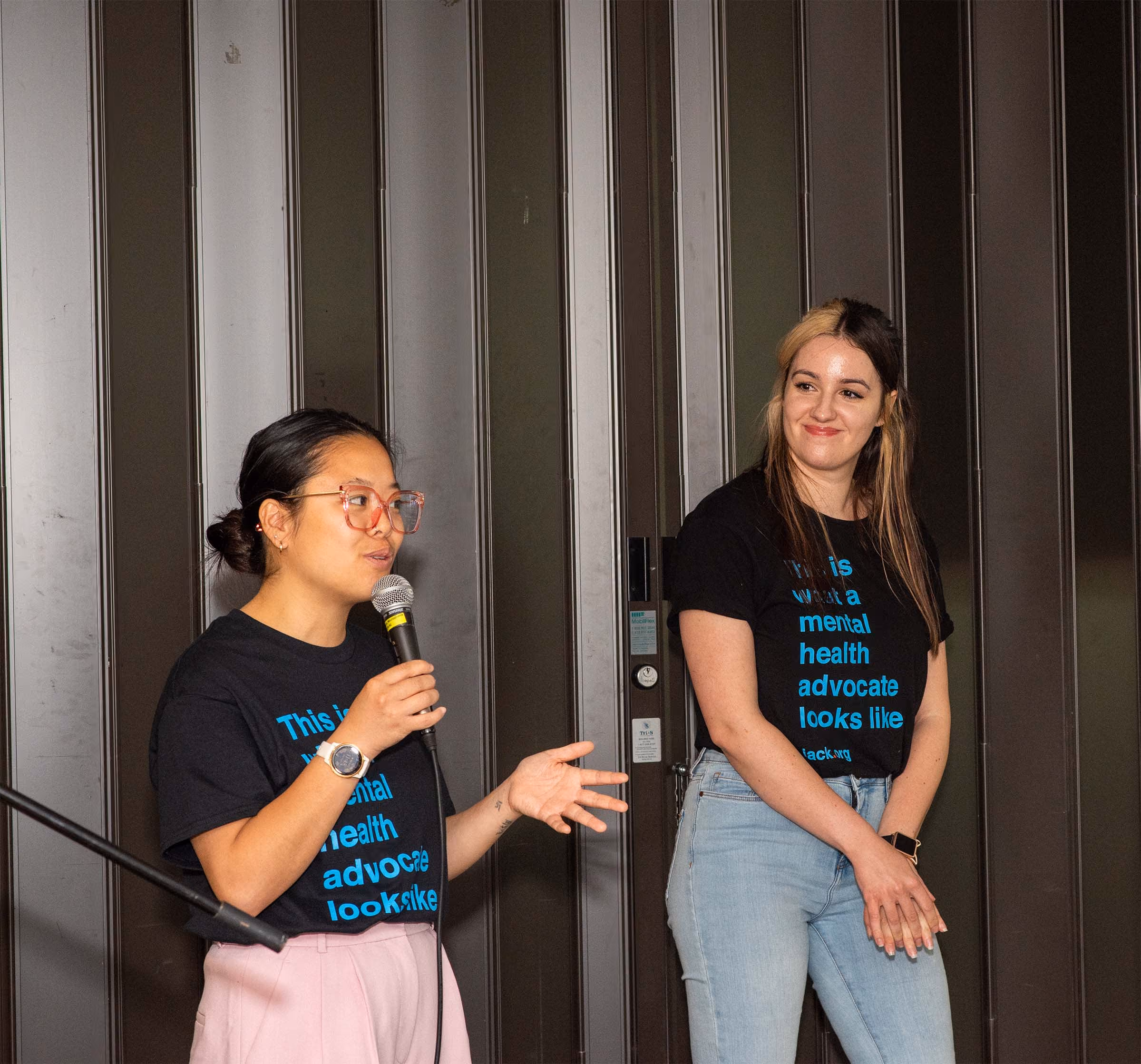 Two speakers with jack.org shirts speaking, medium