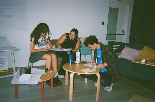 Three participants working at a desk
