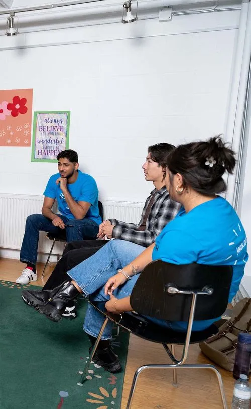 workshop of participants working on projects wearing jack.org merch