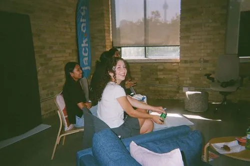 two participants wearing a flag indoors talking in the office
