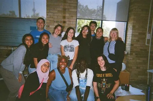 Group photo of participants who are taking a photo, at least 14 people