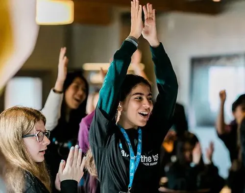 Talk speaker raising their hands