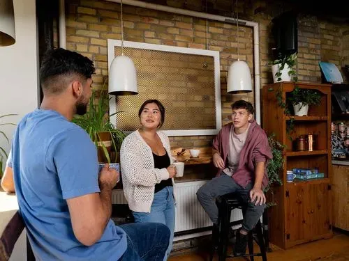 Participants sitting around a coffeee shop chatting